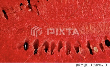 Close-up of ripe fresh sweet juicy watermelon, natural food background Close-up of ripe fresh sweet juicy watermelon, natural food background 129096791