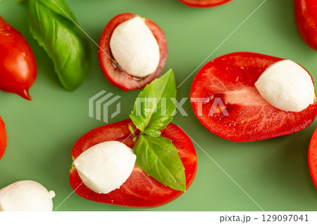 caprese ingredients on green background in studio caprese ingredients on green background in studio 129097041