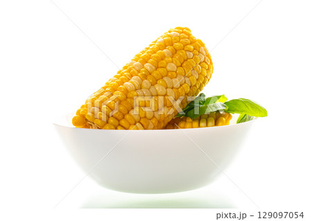 large boiled corn isolated on a white background large boiled corn isolated on a white background 129097054