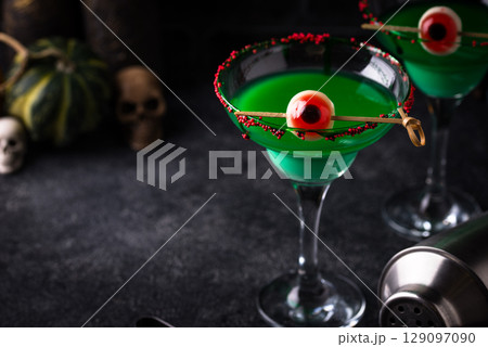 Spooky green halloween cocktail with eyeballs Spooky green halloween cocktail with eyeballs 129097090