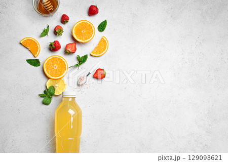 Isotonic sport drink bottle with fruits, berries and salt Isotonic sport drink bottle with fruits, berries and salt 129098621