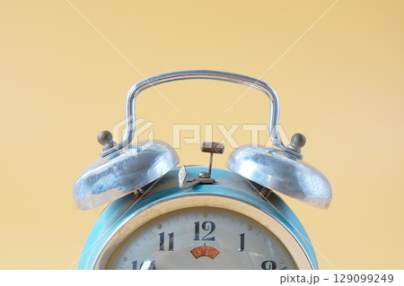Old alarm clock with bell on the top, antique classic alarm clock. Old alarm clock with bell on the top, antique classic alarm clock. 129099249
