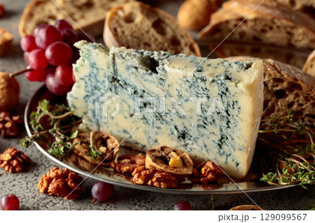 Gorgonzola with ciabatta, walnuts, red grapes, and thyme. Gorgonzola with ciabatta, walnuts, red grapes, and thyme. 129099567
