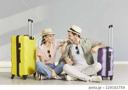 Young happy couple, family tourist people in bright summer trip holiday beach wear, packing luggage 129102759