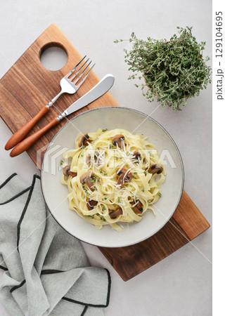 Mushroom pasta with cream parmesan cheese 129104695