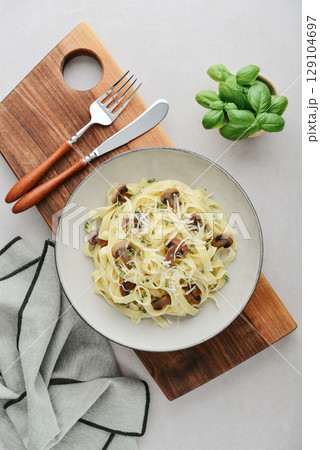 Mushroom pasta with cream parmesan cheese 129104697