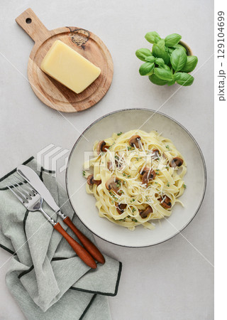 Mushroom pasta with cream parmesan cheese 129104699