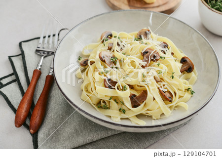 Mushroom pasta with  parmesan cheese 129104701