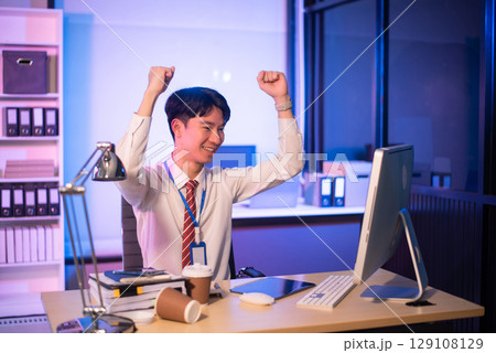 Overworked young Asian businesswoman office worker suffering from neck pain after had a long day at her office desk. Overworked young Asian businesswoman office worker suffering from neck pain after had a long day at her office desk. 129108129