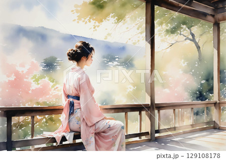 縁側に座ってくつろぐ浴衣姿の女性、和の風情漂う穏やかな午後 129108178