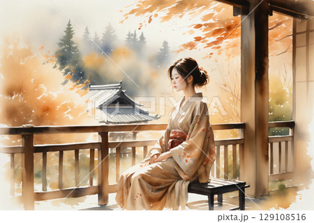 縁側に座ってくつろぐ浴衣姿の女性、和の風情漂う穏やかな午後 129108516