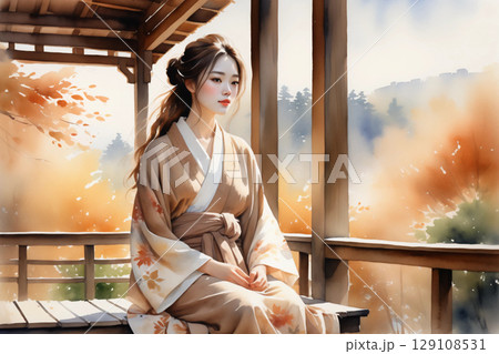 縁側に座ってくつろぐ浴衣姿の女性、和の風情漂う穏やかな午後 129108531