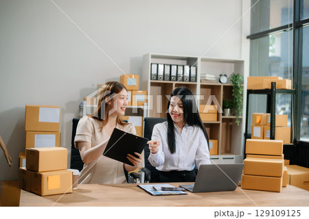 Starting small businesses SME owners, two check online orders Selling products working with boxs freelance work 129109125