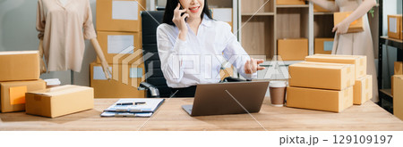 Starting small businesses SME owners, two check online orders Selling products working with boxs freelance work 129109197
