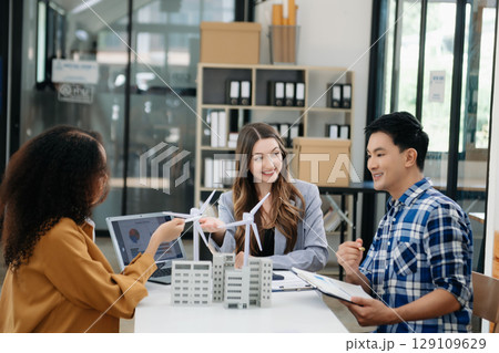 Discussion among businesspeople on the latest developments in solar cell panel technology and Solar Energy Environment city Concept. Discussion among businesspeople on the latest developments in solar cell panel technology and Solar Energy Environment city Concept. 129109629