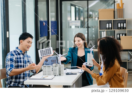 Discussion among businesspeople on the latest developments in solar cell panel technology and Solar Energy Environment city Concept. Discussion among businesspeople on the latest developments in solar cell panel technology and Solar Energy Environment city Concept. 129109630
