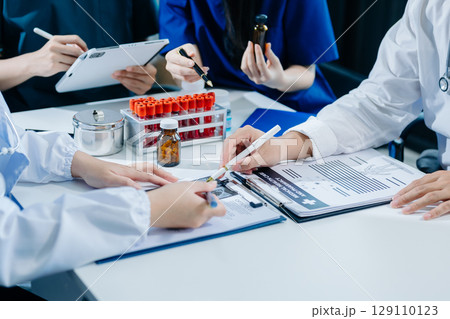 Medical technology network team meeting concept. Doctor hand working with smart phone modern digital tablet and laptop Medical technology network team meeting concept. Doctor hand working with smart phone modern digital tablet and laptop 129110123