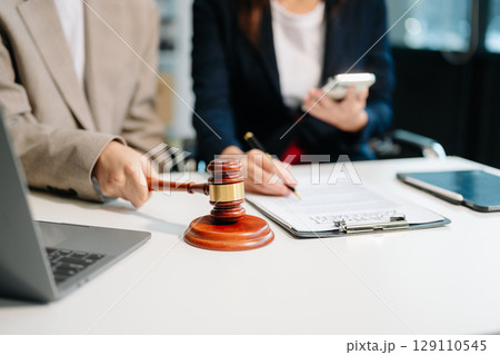 Business law concept, Lawyer business lawyers are consulting lawyers for women entrepreneurs to file copyright lawsuit with laptop and tablet Business law concept, Lawyer business lawyers are consulting lawyers for women entrepreneurs to file copyright lawsuit with laptop and tablet 129110545