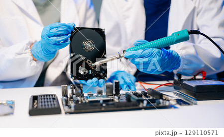 Electronics technician, electronic engineering electronic repair, electronics measuring and testing, repair and maintenance concepts.uses a voltage meter to check 129110571