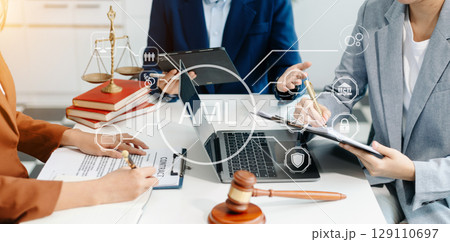 AML Anti Money Laundering Financial Bank Business Concept. judge in a courtroom using laptop and tablet AML Anti Money Laundering Financial Bank Business Concept. judge in a courtroom using laptop and tablet 129110697