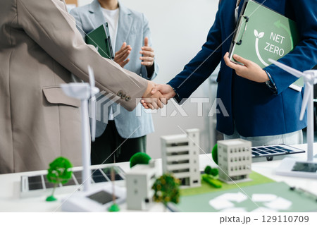 Business team people planning hand using laptop for working technology and business Net zero and carbon neutral concept.NET ZERO icons 129110709