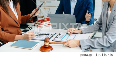 business people and lawyers discussing contract papers sitting at the table. Concepts of law, advice, legal services. 129110710