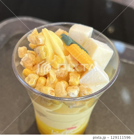 Smooth and creamy corn gelato with a rich, sweet, and slightly nutty flavor. A unique and refreshing frozen treat, blending natural corn sweetness with a velvety texture. 129111596