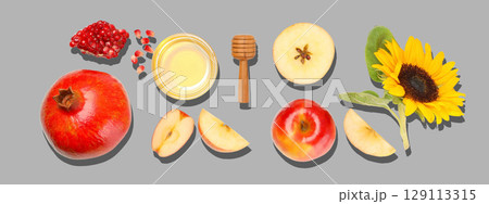 Colorful fruits and honey create a beautiful display with sunflower Colorful fruits and honey create a beautiful display with sunflower 129113315