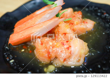 The Spicy Salmon Salad on the black plate The Spicy Salmon Salad on the black plate 129113422