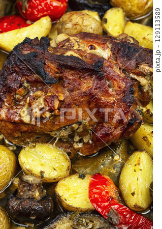 Delicious baked pork, food background. 129113589