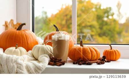 Orange pumpkin for fall autumn holiday season decoration, latte cup with cream Orange pumpkin for fall autumn holiday season decoration, latte cup with cream 129113639