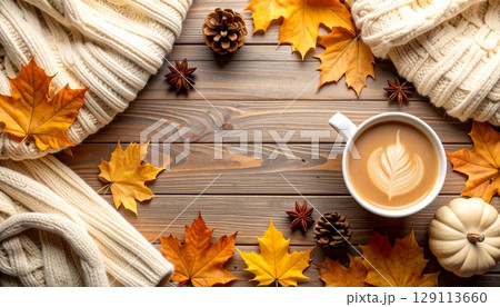 Autumn still life with leaves, coffee, and pine cone on a wooden background 129113660