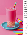 Bright pink fruit drink with tapioca balls at the bottom. Bright background, cooling drink. 129116233