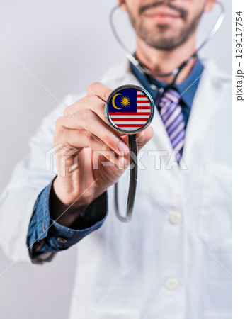 Malaysia health and medical insurance concept. Malaysia healthcare system, doctor holding stethoscope 129117754