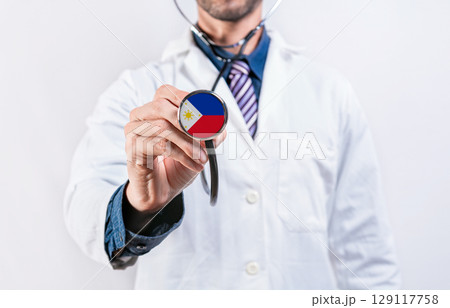 Philippines healthcare system, doctor holding stethoscope. Philippines health and medical insurance concept 129117758