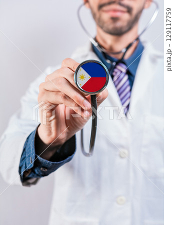 Philippines health and medical insurance concept. Philippines healthcare system, doctor holding stethoscope 129117759