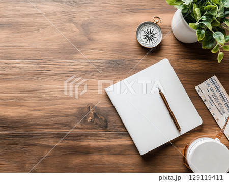 minimalist flat-lay of an open passport surrounded by travel accessories like maps, compass, and tickets. AI Generated. 129119411