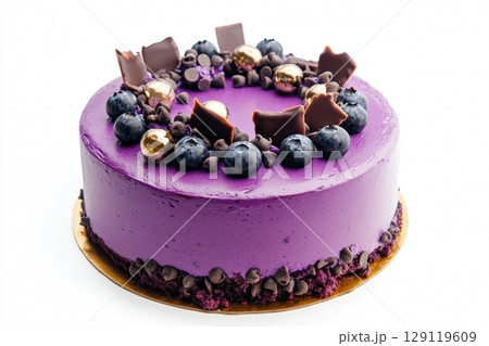 Cake with glossy pink mirror coating, decorated with delicate cream curls, fresh blueberries, chocolate elements and decorative balls. Concept of advertising of confectionery products, restaurant menu 129119609