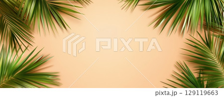 Tropical leaves frame. Green color tropics foliage on Peach fuzz solid background. Empty space in the center for product presentation. Flat lay, top view, copy space. Summer concept, minimalists style 129119663