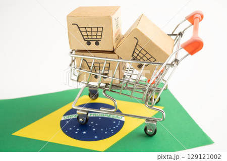 Brazil shopping, Shopping cart box on Venezuala flag, import export, finance commerce. 129121002