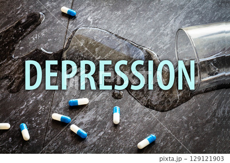 The inscription depression on the background of scattered pills. 129121903