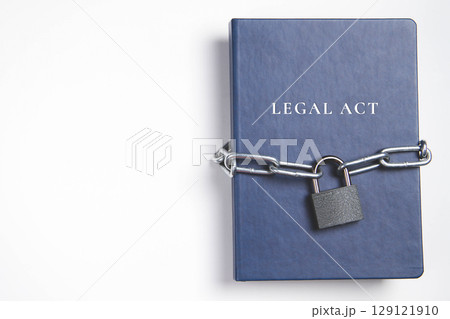 Legal act. Book with lock. A closed book is banned. Chain on the book. Legal act. Book with lock. A closed book is banned. Chain on the book. 129121910