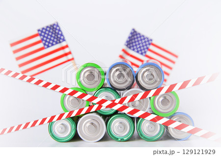 Battery. A lot of batteries on the background of the flag of the country. Battery. A lot of batteries on the background of the flag of the country. 129121929