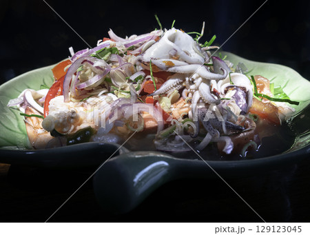 Close-up of Spicy seafood salad with Lemongrass (Thai style spicy). Close-up of Spicy seafood salad with Lemongrass (Thai style spicy). 129123045