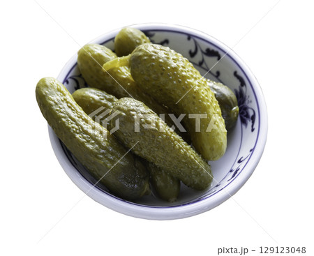 Pickled Cornichons in Vinegar on Ceramic cup isolated on white background with clipping path. Pickled Cornichons in Vinegar on Ceramic cup isolated on white background with clipping path. 129123048