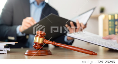 Legal Consultation. Gavel and documents on lawyer's desk. Legal Consultation. Gavel and documents on lawyer's desk. 129123293