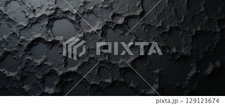 Dark rough cracked surface with irregular holes and textured details, resembling meteorite, volcanic rock, or alien terrain in abstract style 129123674
