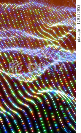 Abstract rainbow waves composed of multicolored glowing dots in a dynamic fluid pattern Abstract rainbow waves composed of multicolored glowing dots in a dynamic fluid pattern 129123952