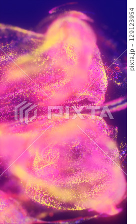 Abstract colorful particles swirling in deep purple space, forming glowing flowing trails and soft jelly-like structures Abstract colorful particles swirling in deep purple space, forming glowing flowing trails and soft jelly-like structures 129123954
