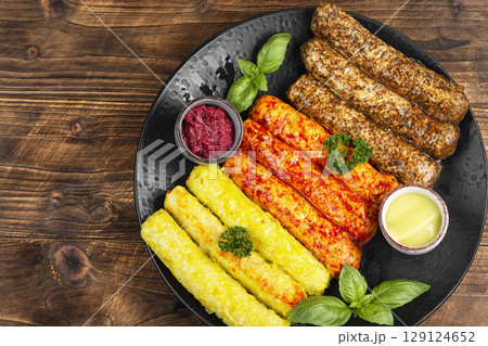 Delicious, uncooked sausages. Delicious, uncooked sausages. 129124652